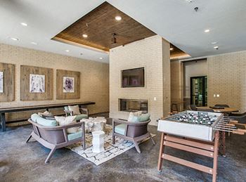 Entertainment area featuring 75'' hdtv with poker and foosball tables